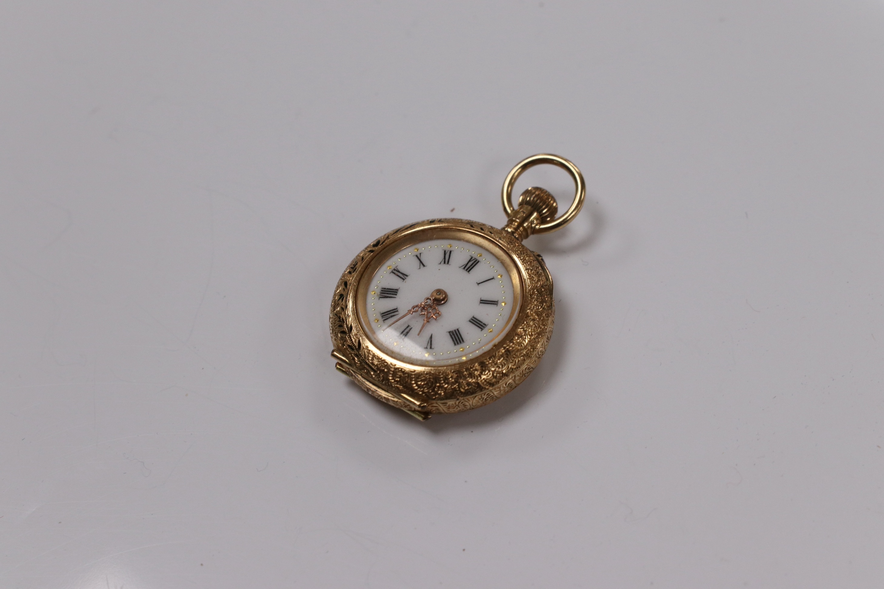 A lady's 14ct and enamel open face keyless fob watch, gross weight 16.6 grams. Condition - poor to fair